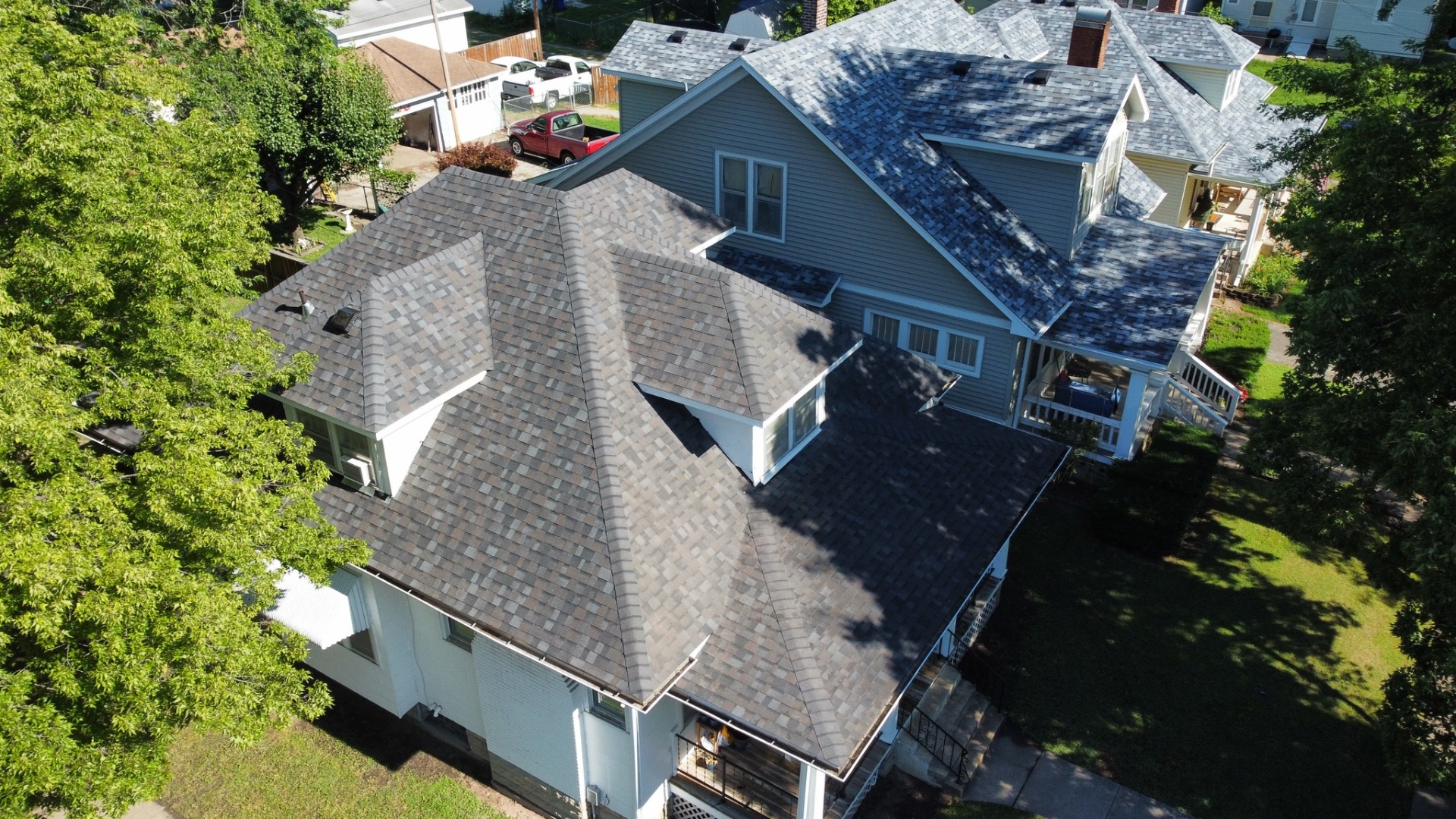Residential roof replacement in progress — crew on site
