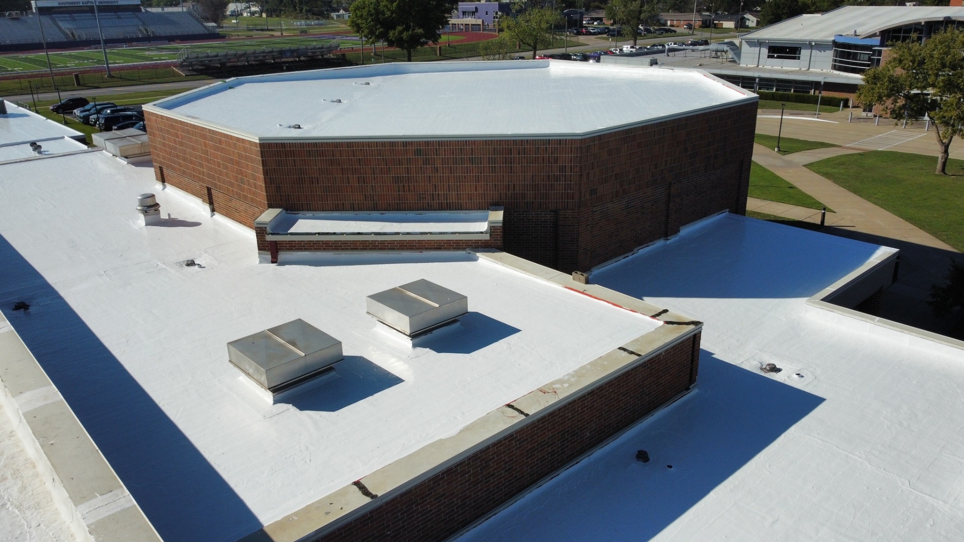 Commercial roof coating application by Blue Ox Roofing